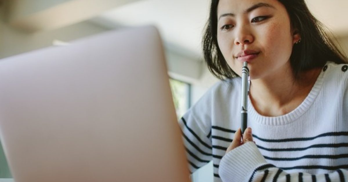 Asian woman studying at home